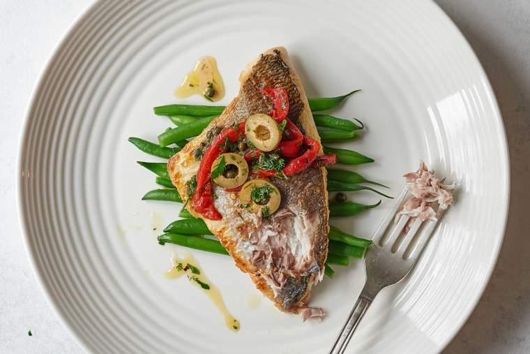 Pan-fried white fish with roasted pepper, caper and olive dressing